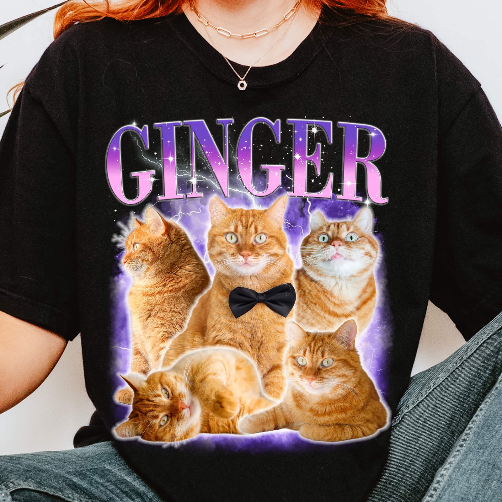Woman wearing a black GINGER T-shirt with purple gradient lettering above a collage of five orange cats; the center cat wears a black bow tie against a purple lightning background.