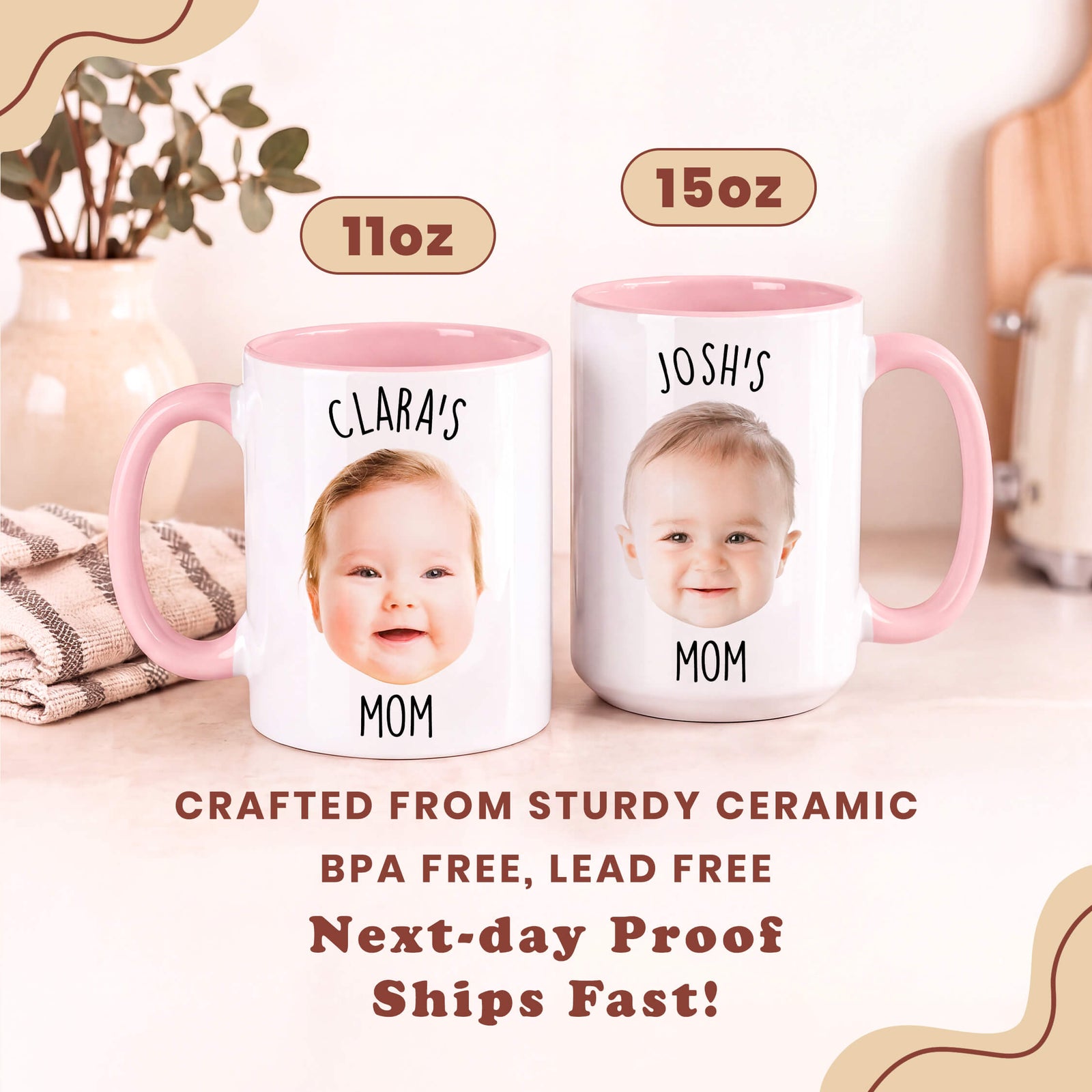 Two personalized ceramic mugs with pink handles and interiors, shown side by side on a light beige tabletop. The left mug is labeled 11oz and features the photo of a baby with the text 'CLARA'S MOM'; the right mug is labeled 15oz and features a baby photo with the text 'JOSH'S MOM'.